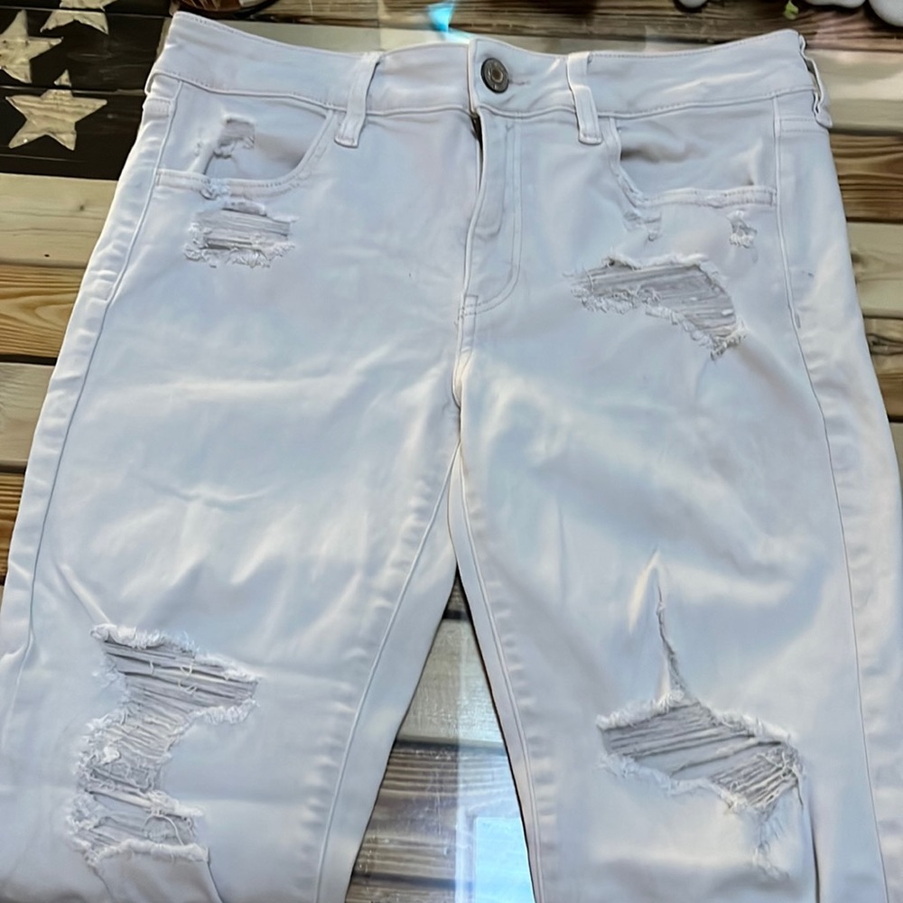 Used American Eagle super stretch size 10 in fair condition. Pale pink color.